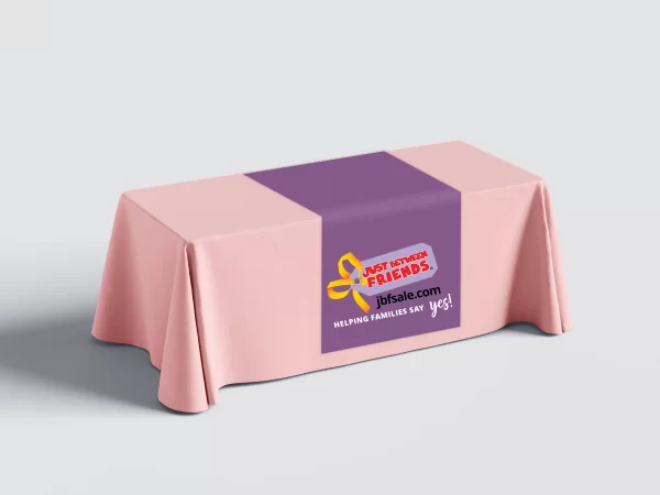 Purple just between friends table runner on a coral table cloth