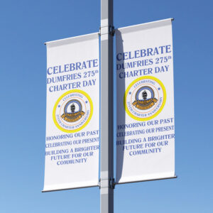 WHITE LIGHT POLE BANNER CELEBRATING CITY MILESTONE